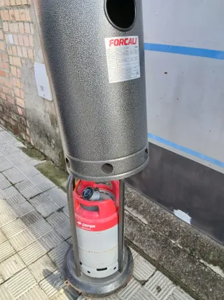 Estufa seta gas metal gris y bombona muy poco huso