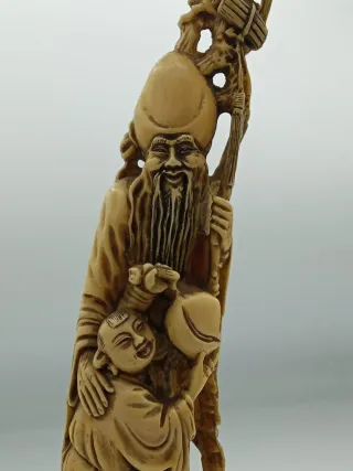 Statua orientale in resina con bambino