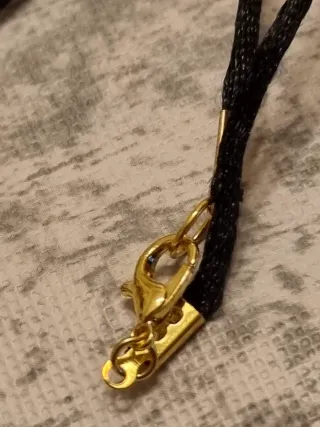 Collana con pendente a forma di rosa e stella