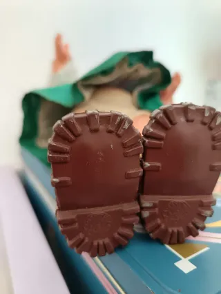 Bambola vintage con vestito verde