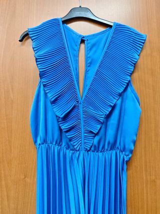 Tuta elegante blu con pantaloni plissettati