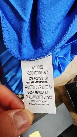 Tuta elegante blu con pantaloni plissettati