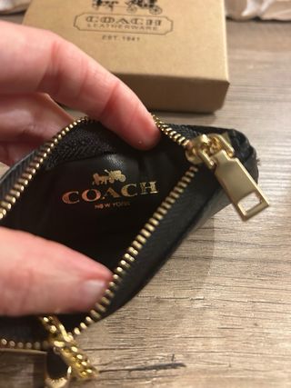 Portamonete Coach monogram nero e oro