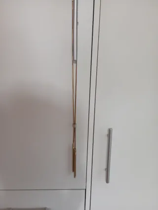 Colgante dorado con flecos