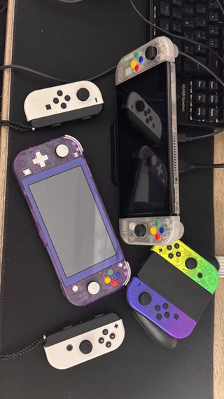 Nintendo Switch Lite morado transparente + Juegos
