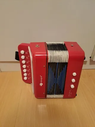 Acordeón de juguete rojo
