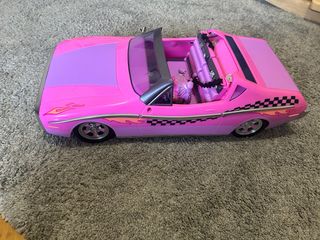 Coche de muñecas rosa convertible