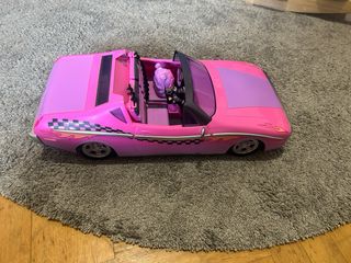 Coche de muñecas rosa convertible