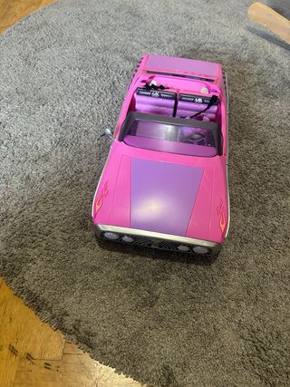 Coche de muñecas rosa convertible