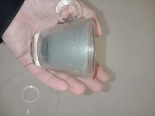 Candela in tazzina da caffè in vetro