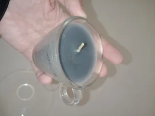 Candela in tazzina da caffè in vetro