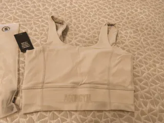 Top deportivo Agongym beige talla S nuevo