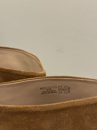 Botas altas ante Zara