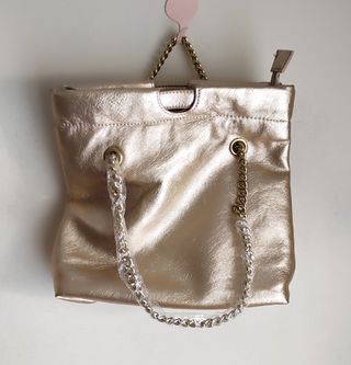 Bolso dorado multi posición nuevo 29x37x1