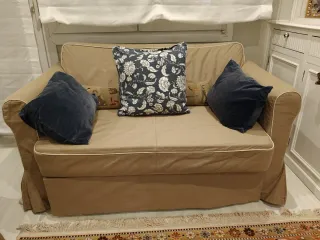 Sofá cama beige y azul