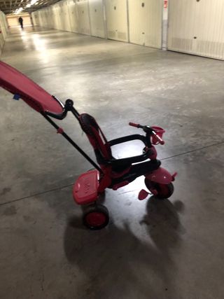 Triciclo infantil rosa y rojo
