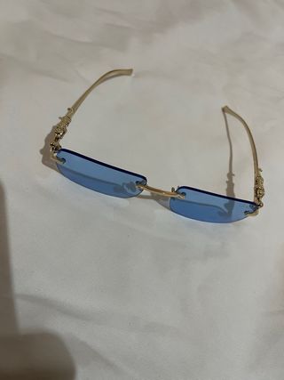 Gafas de lujo doradas y azules (Cartier)
