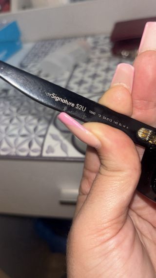 Gafas de sol Dior negras y doradas