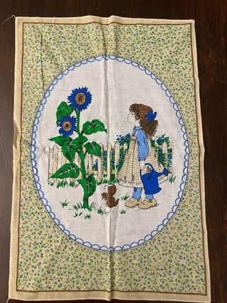 Strofinaccio vintage con bambina e girasoli