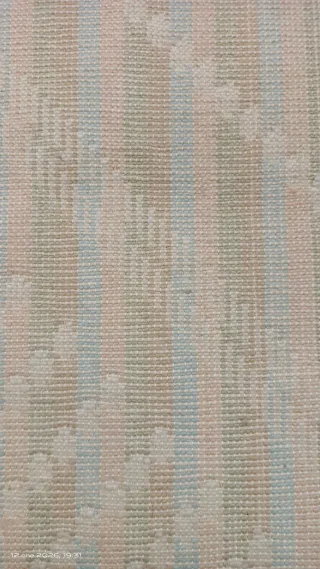 Alfombra tejida de lana multicolor