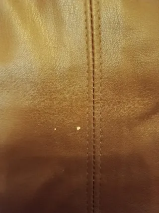 Pantaloni marroni in pelle a zampa