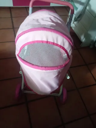 Cochecito de muñecas rosa