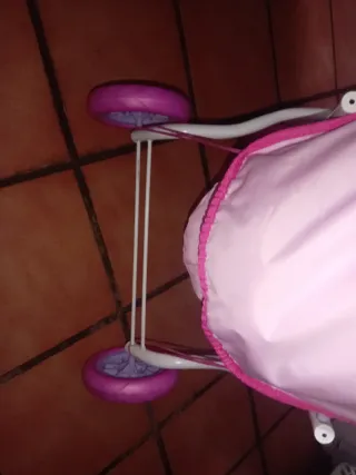 Cochecito de muñecas rosa