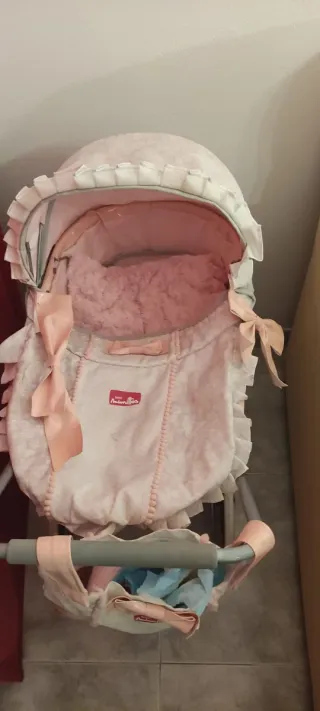 Carrito de muñecas de juguete rosa