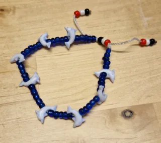 Set collana e bracciale con delfini