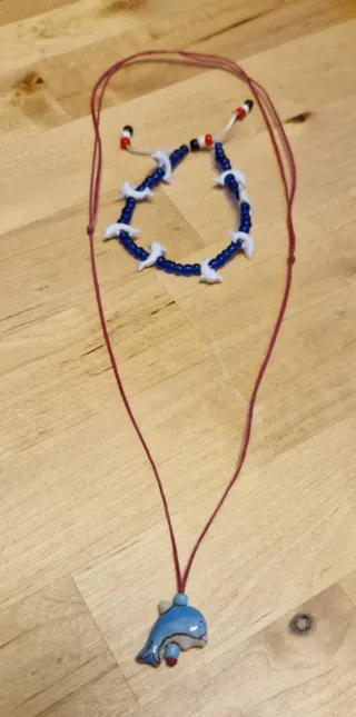 Set collana e bracciale con delfini