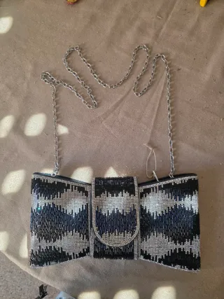 Bolso pajarita negro y plateado