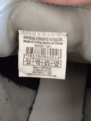 Zapatillas Kipsta tacos fútbol negras y blancas