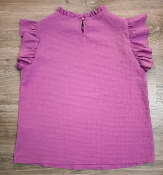 Blusa rosa con volantes