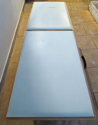 Camilla de masaje plegable.