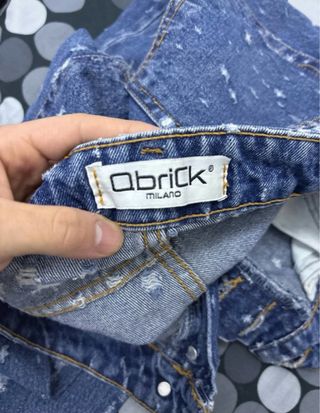 Jeans strappati effetto schizzi