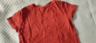 Maglietta neonato arancione con taschino