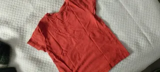 Maglietta neonato arancione con taschino