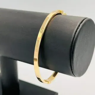 PULSERA TIPO CARTIER RIGIDA TORNILLO.Hueca.Oro 18k