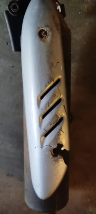 -Honda 100cc. Tubo de escape