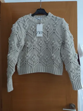 Jersey punto trenzado pompones