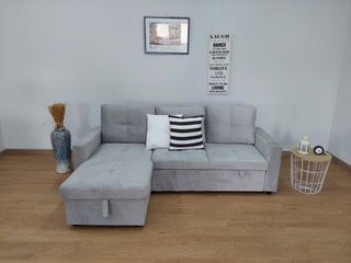 Sofá cama gris de tela con rinconera y arcon nuevo