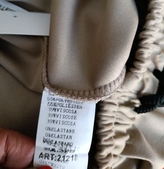 Pantalón palazzo beige con líneas laterales