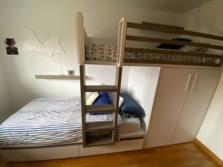 Litera nido con armario y cajones.