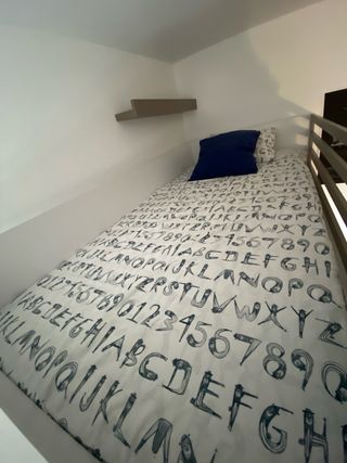 Litera nido con armario y cajones.