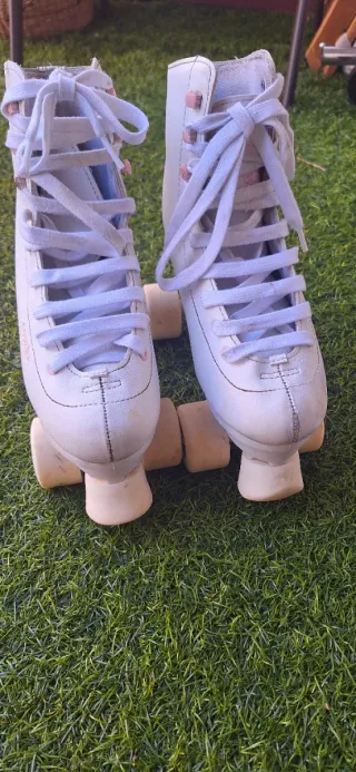 Patines artisticos Oxelo blancos y rosas