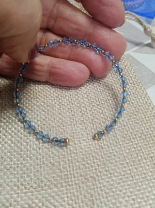 Braccialetto Swarovski cristalli azzurri e oro 750