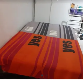 Sofá-cama click-clack gris y naranja