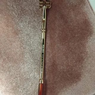 Gafas de sol Miu Miu mujer negras y doradas