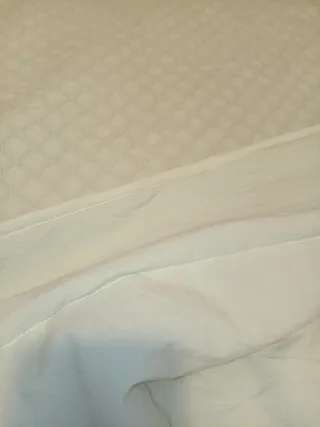 Colcha edredón verde.