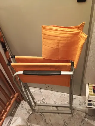 Silla plegable director entre naranja y  amarillo